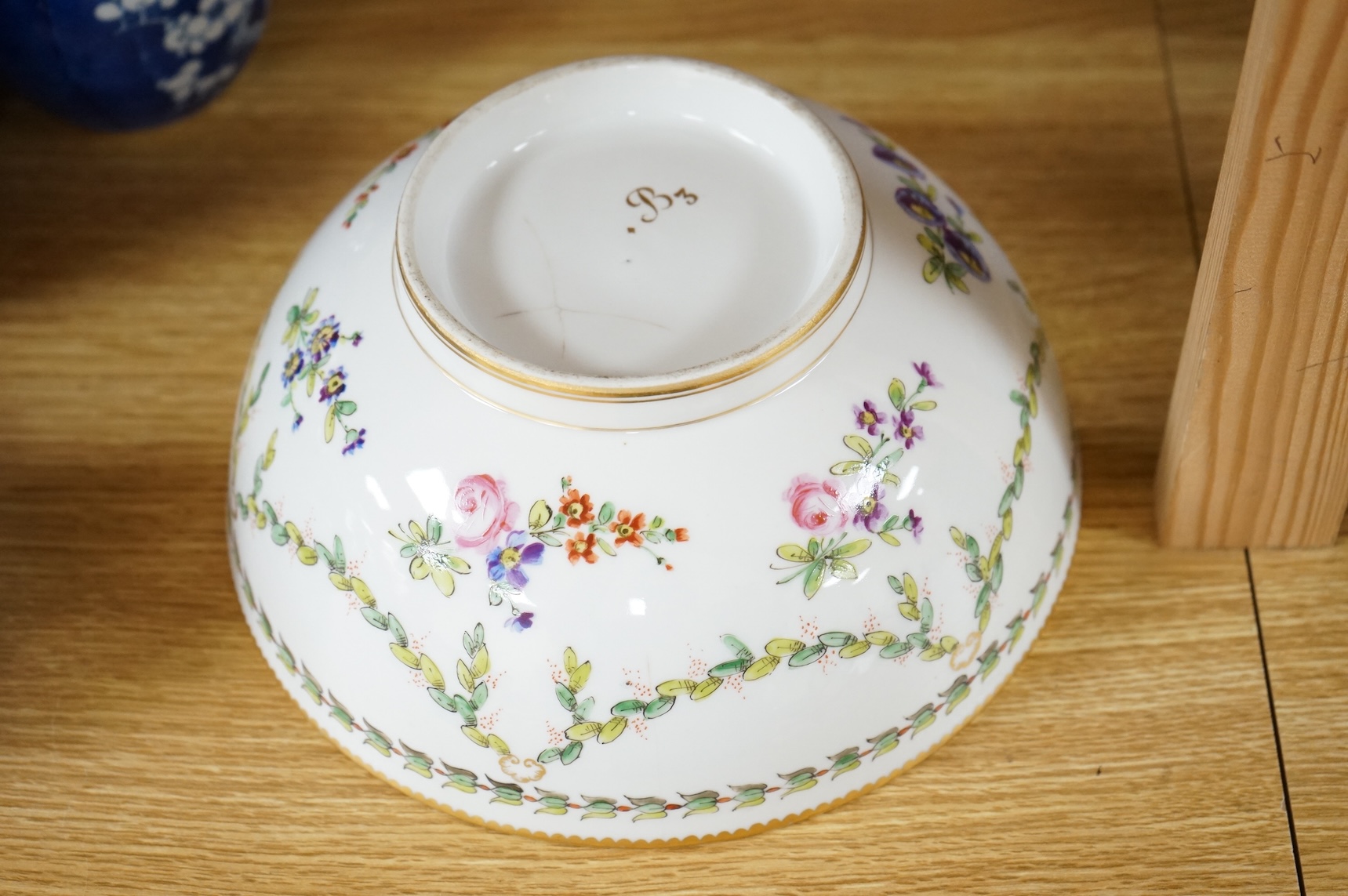 A Continental copy of a Bristol Champions bowl, rose and gilt decorated, 23cm diameter.